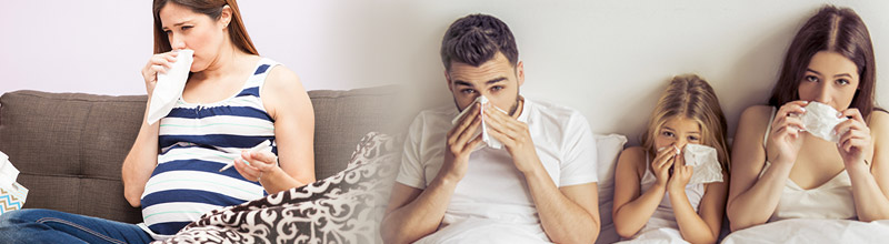 Personas con gripe y pañuelos